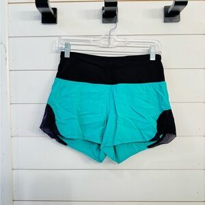 Lululemon workout shorts, teal and black, small (size 4)